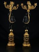 A pair of large 20th century French Empire style brass candelabras each having five scrolling