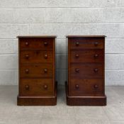 A pair of mid 19th century dwarf or bedside chests of four graduating drawers on plinth bases with