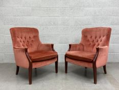 A pair of 20th century Parker Knoll model PK. 1022-27 armchairs each having a shaped button back
