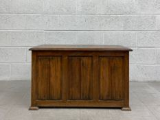 A mid century oak Jacobean style coffer with linenfold carved panels. H.53 W.89 D.41cm