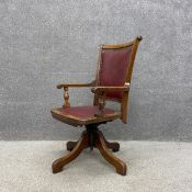 A late 19th century American oak revolving desk or office chair having a curved and reeded frame