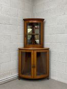 An Edwardian mahogany two section bow fronted corner display cabinet. H.157 W.81 D.60cm