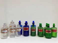 A collection of fifteen C.1900 apothecary jars to include five clear glass bottles of cylindrical