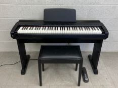 A Technics PX100 digital piano with stool and Yamaha pedal, in working order. H.91 W.122cm