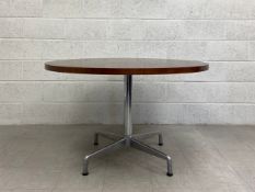 A mid-century dining table having a circular teak top raised on a cylindrical aluminium stem with
