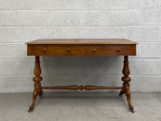 A 19th century walnut side table fitted with frieze drawers on stretchered cabriole supports. H.75