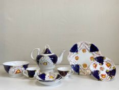 A collection of 19th century Gaudy Welsh tulip pattern porcelain to include a lidded teapot, two tea