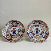 A pair of 19th century Japanese hand painted Imari chargers each having central stylised vase and