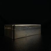 An English hallmarked silver cigarette box, engine turned and cedar lined. H.5 W.16.5cm