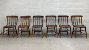 A set of six 19th century elm bar back country kitchen style dining chairs with panel seats on
