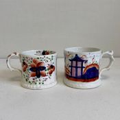 Two mid 19th century Gaudy Welsh porcelain mugs each with a moulded scrolling handle hand