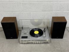A vintage Toshiba record player with integrated tape deck and a pair of matching speakers.