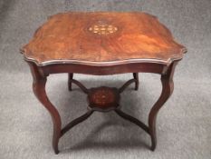 A 19th century rosewood and satinwood marquetry inlaid centre table having a moulded quatrefoil