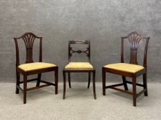 A pair of 19th century Georgian style mahogany dining chairs each having an arched top rail with a