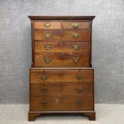 A Georgian mahogany chest on chest having a dentil moulded cornice above two short over three long