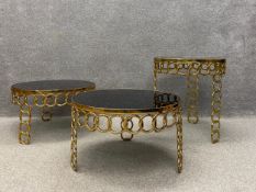 A set of three 20th century occasional tables by Hanbel each having a circular black glass top