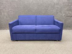 A contemporary two seater sofa bed of square box form in an indigo chenille upholstery. H.76 W.153