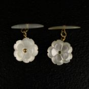 A pair of 20th century yellow metal mounted mother of pearl torpedo back cufflinks. (Tests as 10ct