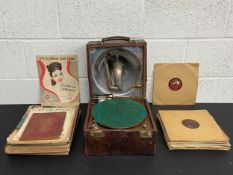 A collection of early 20th century score sheets, 78's or Shellac records, and a portable