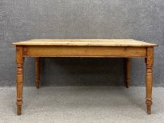 A Victorian pine country farmhouse dining table having a large rectangular top over a single