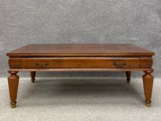 A Victorian style teak coffee table having a rectangular parquetry inlaid and crossbanded top over a