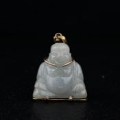 A yellow metal mounted figural jade Laughing Ho Tai Buddha pendant with an openwork Chinese 'Fu'