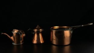 A collection of four pieces of 20th century copper to include a watering can, a lidded pot and two