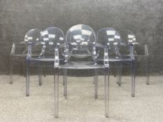 A set of six clear shock and weatherproof polycarbonate Louis Ghost armchairs designed by Phillipe