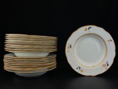 A matched set of ten Wedgewood bowls and nine plates with maker's marks to the base. W.24.5cm