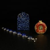 Three pieces of jewellery to include a piece of Chinese Lapis Lazuli carved all over with
