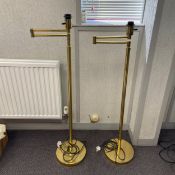 A pair of brass standard reading lamps with articulated adjustable arms. H.120cm