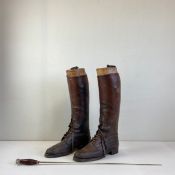 A pair of early 20th century brown leather riding boots with gilt metal mounted oak trees
