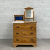 A C.1900 pine dressing chest having a superstructure comprised of a tiled gallery back and a