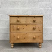 A C.1900 pine chest of drawers having a rectangular thumb moulded top above two short over two