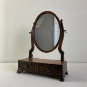 A small late 19th century mahogany toilet mirror with swing frame and original plate. H.41.5cm
