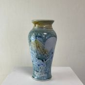 A contemporary studio pottery vase of baluster form hand decorated with a stylised sgraffito chicken