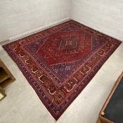 A large Persian Meymeh carpet having a central diamond lozenge surrounded by repeating tree of