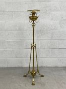 A C.1900 brass floor standing oil lamp by Hinks & Son having a squat cup and cover reservoir