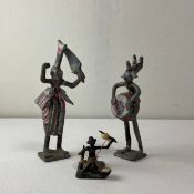 A collection of three cold painted metal African Ashanti figures. H.16cm