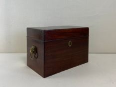 A Georgian mahogany tea caddy mounted with gilt metal lion's head handles. H.22.5 W.33 D.20cm