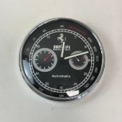 A contemporary Ferrari Chronograph Automatic Tachymeter wall clock having a black dial with