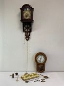 A 20th century Dutch wall clock having an arched and moulded pediment over a hand painted dial