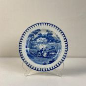 A early 19th century blue and white transfer pearlware plate having a central vignette depicting