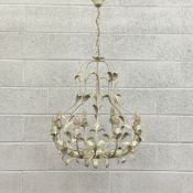A painted and distressed French style wrought metal chandelier having a baluster form openwork