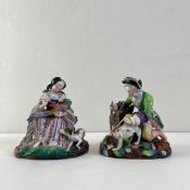 Two 19th century hand painted porcelain figure groups depicting a seated lady with a pheasant and
