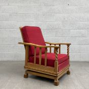 A mid 20th century reclining rocking armchair having a high fabric upholstered back over a pair of