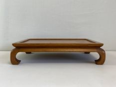 A 20th century Chinese stand or low bonsai tree table. H.10 L.46 W.30.5cm
