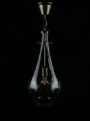 A contemporary pendant light having a powder coated metal fixing and narrow stem with light