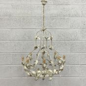 A painted and distressed French style wrought metal chandelier having a baluster form openwork