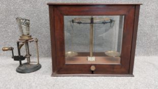 A 19th century Griffin & Tatlock set of brass scales in a glazed mahogany case (incomplete), along